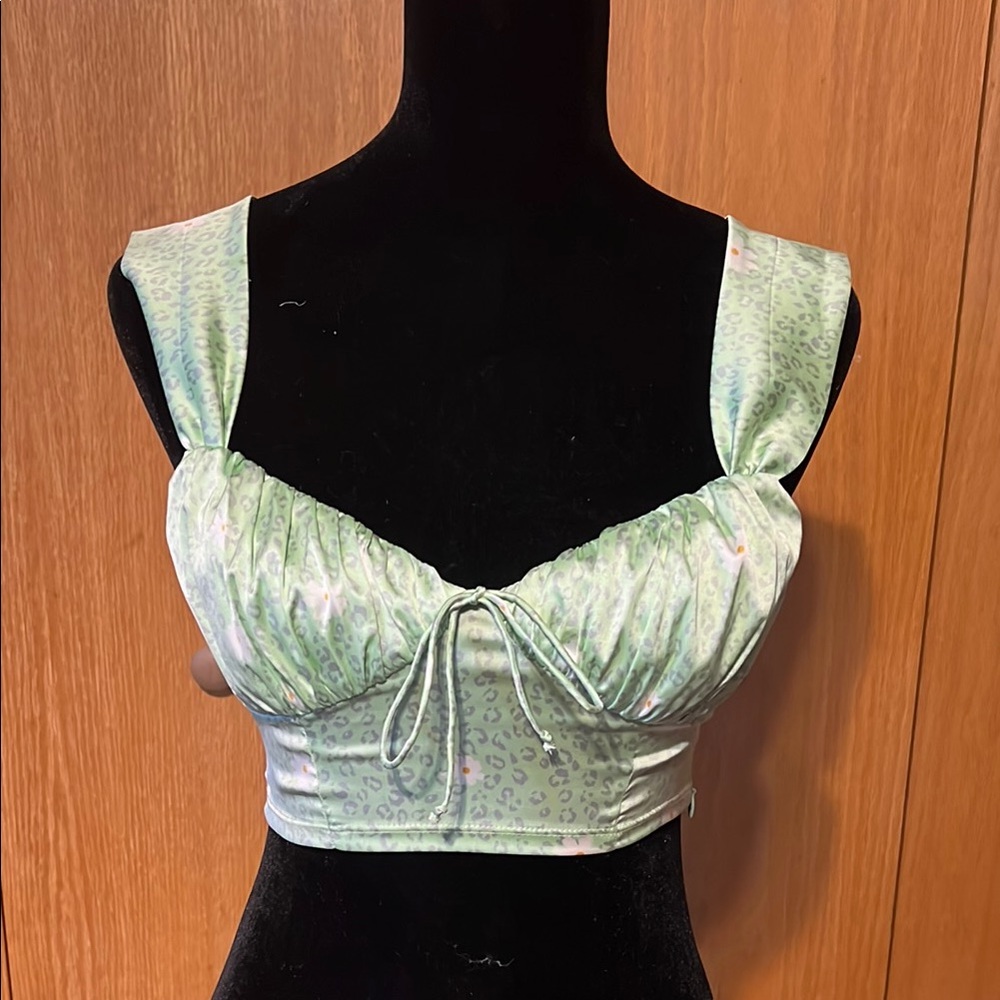 For love and lemons, Robin top mint cheetah.sz. XS great cond.